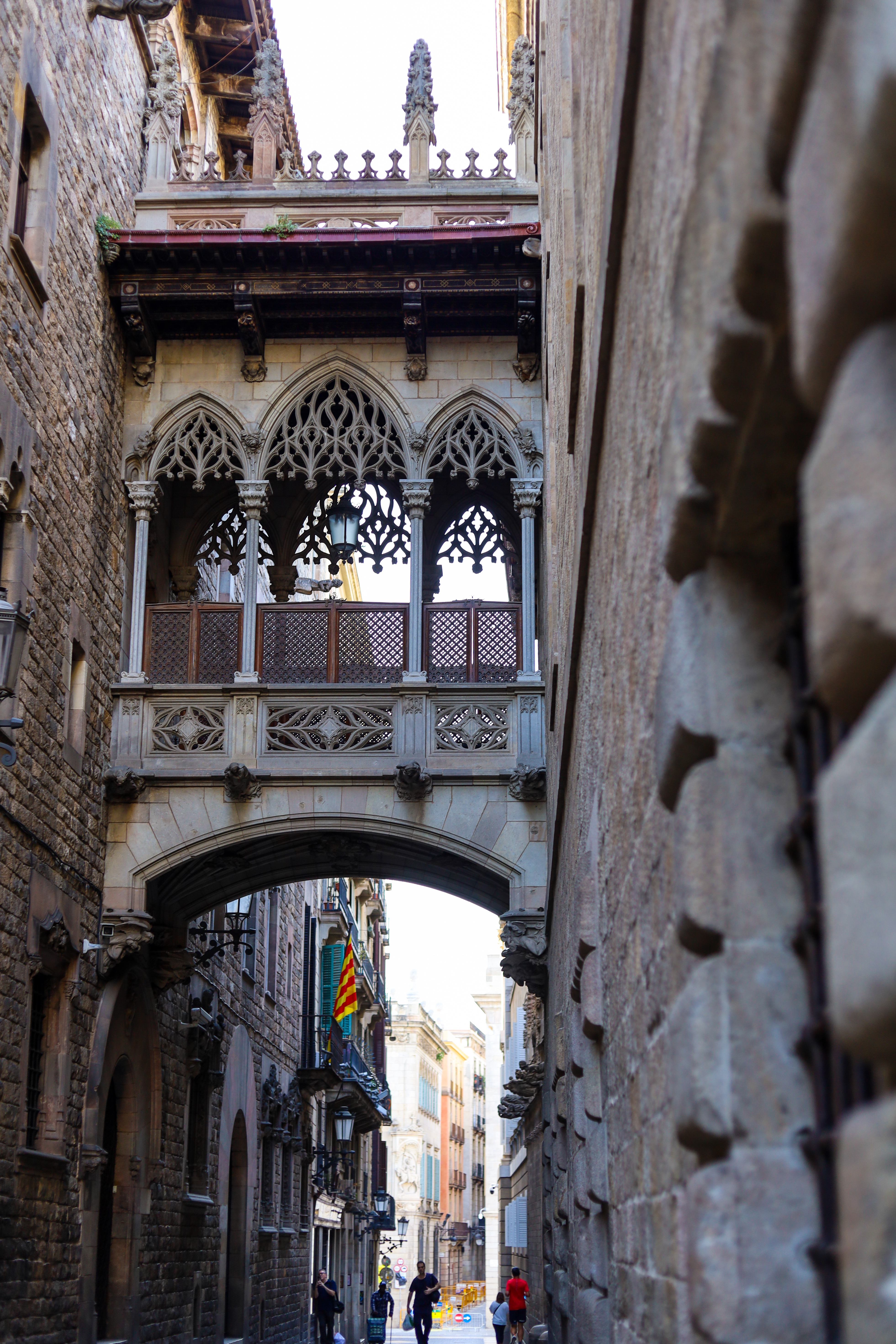 The iconic Pont del Bisbe Gothic bridge spanning a narrow lane in Barri Gòtic